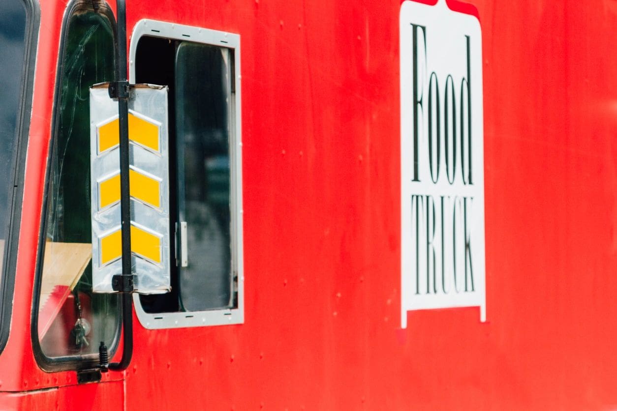 A red wall with some yellow and white stripes on it