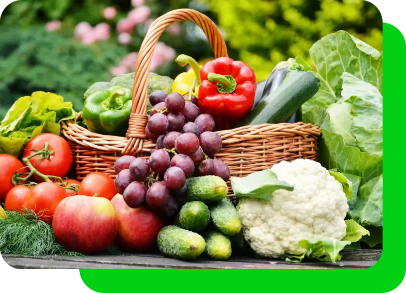 A basket of fruit and vegetables on top of a table.